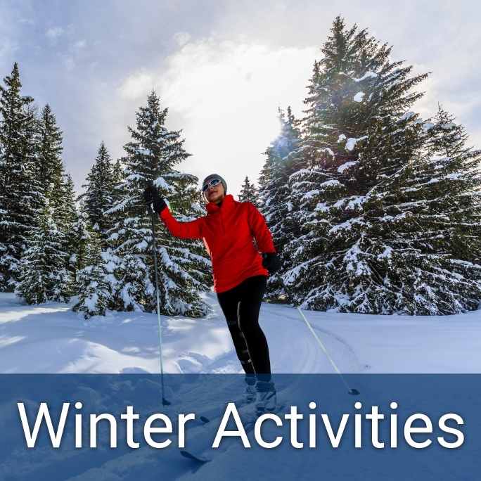 adult female cross country skiing through a snowy forest in winter, header below reads "Winter Activities"
