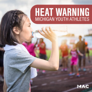 young asian female drinking water with towel around her neck on a track field, out of focus spectators in background, side header reads "Heat Warning Michigan Youth Athletes", Michigan Association of Chiropractors logo in bottom right corner