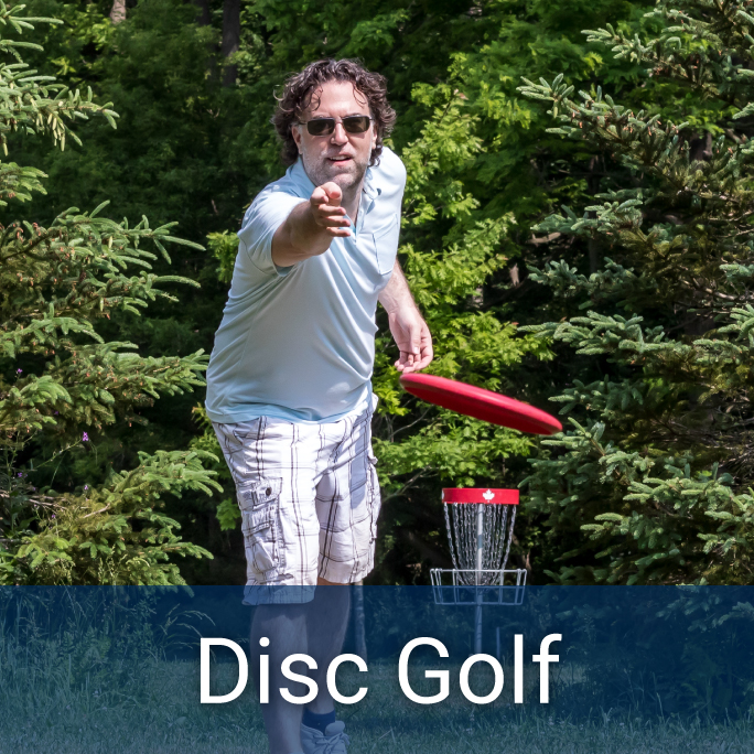 adult male throwing a frisbee on a disc golf course with a disc golf net in the background, bottom header reads: Disc Golf