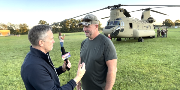 interview-in-front-of-helicopter